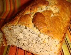 not enough to cause any problems and a table knife around the sides took care of it very nicely. It's a moist and lovely loaf that you'll love if your a banana bread fan.This is a yummy treat. I simply love the poppy seed addition. It's a mild flavored bread but the lemon is noticeable. Mine was well baked at 50 mins (used an 8x4 glass pan) but do be sure to oil or butter the pan well. Mine stuck just a little bit on the sides