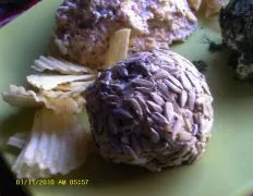 Cheese ball rolled in sunflower seeds; it has wine in it