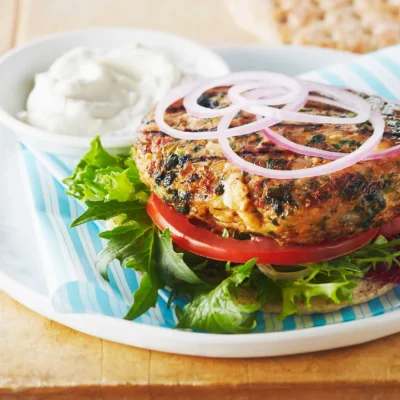 Chicken Tomato And Feta Patties On A Spinach