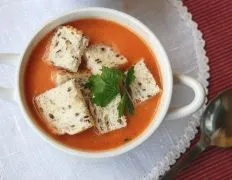 Creamy Tomato Basil Soup with Melted Cheese Garnish