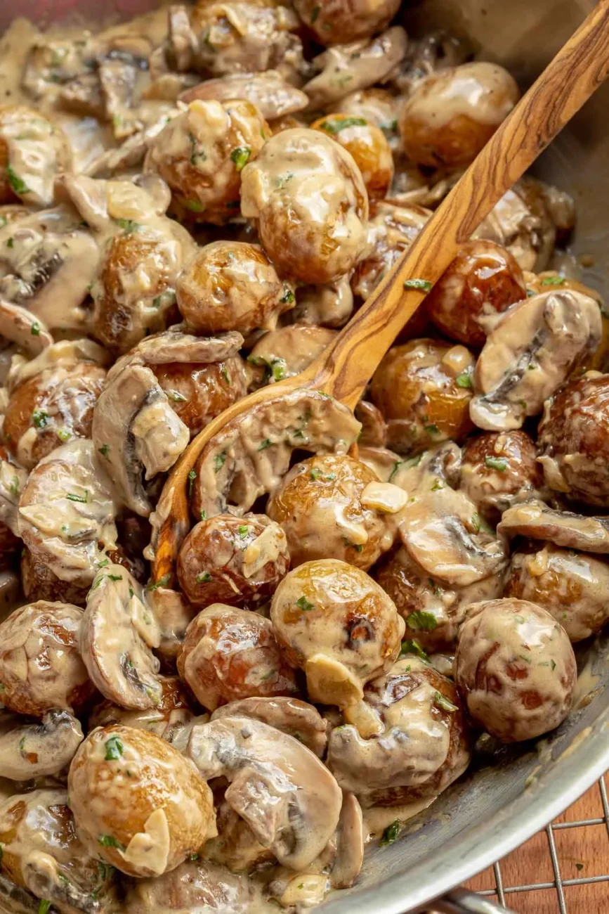 Potatoes With Onion Sauce And Parmesan Cheese