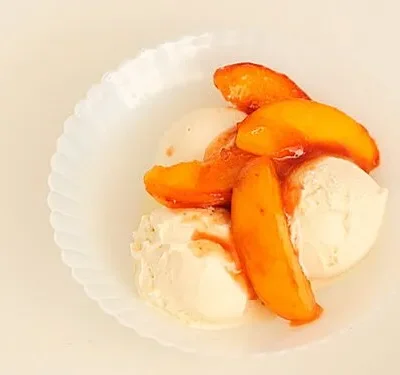 Sauteed Peaches With Vanilla Ice Cream