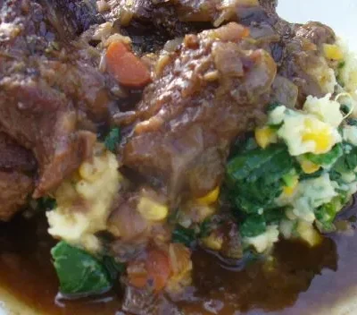 Savory Braised Oxtails With Garlic Spinach