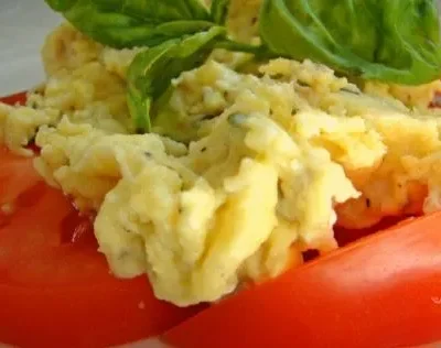 Scrambled Eggs Over Fresh Sliced Tomatoes