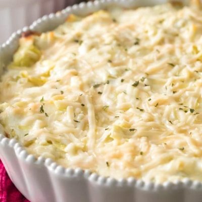 Creamy Spinach And Artichoke Dip Served With Crispy Homemade Pita Chips