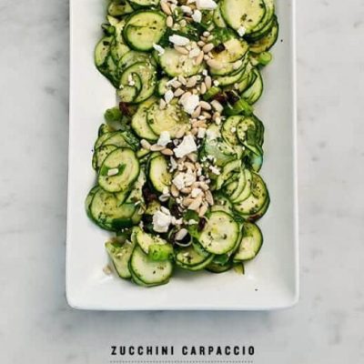 Fresh Zucchini Carpaccio Topped With Feta Cheese And Pine Nuts